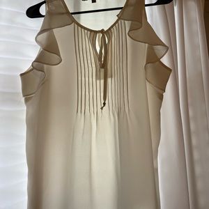 Cream sleeveless blouse